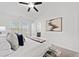 Cozy bedroom featuring soft carpet, natural light, and a view of the en suite bathroom at 1245 Liberty Nw Pkwy # 807, Atlanta, GA 30318