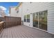 Wooden deck with railing features a sliding glass door to the house and a wooded view at 1245 Liberty Nw Pkwy # 807, Atlanta, GA 30318