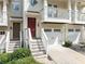 Charming townhome with a welcoming front entrance, garage, and second story balcony at 1245 Liberty Nw Pkwy # 807, Atlanta, GA 30318