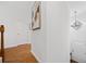 Bright hallway features gleaming hardwood floors and modern lighting fixture at 1245 Liberty Nw Pkwy # 807, Atlanta, GA 30318