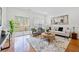 Inviting living area with hardwood floors, access to a balcony, and plenty of seating at 1245 Liberty Nw Pkwy # 807, Atlanta, GA 30318