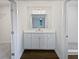 Modern bathroom with white cabinets, quartz countertops, and a tile shower at 5520 Morning Creek Cir, Atlanta, GA 30349