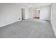 Large bedroom featuring soft carpet, natural light and an adjacent bathroom at 5520 Morning Creek Cir, Atlanta, GA 30349
