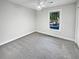 Bright bedroom featuring plush carpeting and ample natural light at 5520 Morning Creek Cir, Atlanta, GA 30349