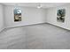 Spacious bedroom with a ceiling fan and natural light from two windows at 5520 Morning Creek Cir, Atlanta, GA 30349