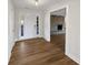 Inviting foyer with hardwood floors leading into a spacious living area with a brick fireplace at 5520 Morning Creek Cir, Atlanta, GA 30349