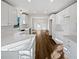 A kitchen featuring all white cabinets, modern countertops and stainless steel appliances and hardwood floors at 5520 Morning Creek Cir, Atlanta, GA 30349