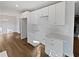 Kitchen with bright white cabinets, sleek countertops and hardwood flooring at 5520 Morning Creek Cir, Atlanta, GA 30349