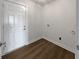 Laundry room featuring LVP floors and hookups for washer and dryer at 5520 Morning Creek Cir, Atlanta, GA 30349