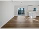 Living room with abundant natural light, wood flooring, and views of the backyard at 5520 Morning Creek Cir, Atlanta, GA 30349