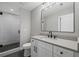 Modern bathroom with a glass enclosed shower and stylish gray accents at 837 Lakemont Dr, Canton, GA 30114