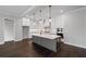 Modern kitchen featuring an island, pendant lighting, and stainless steel appliances and white cabinetry at 837 Lakemont Dr, Canton, GA 30114