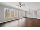 Spacious open-concept living area filled with natural light, showcasing hardwood floors and access to an outdoor deck at 837 Lakemont Dr, Canton, GA 30114