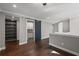Open loft space with hardwood floors, built-in shelving, and access to a laundry room, perfect for flexible living at 837 Lakemont Dr, Canton, GA 30114