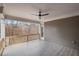 Covered porch with a ceiling fan, wood railings, and beautiful tree views at 837 Lakemont Dr, Canton, GA 30114