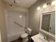 This bathroom features a bathtub and shower combo, as well as a toilet and vanity at 2992 Parc Lorraine, Lithonia, GA 30038