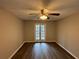 This bedroom features hardwood floors and glass doors at 2992 Parc Lorraine, Lithonia, GA 30038