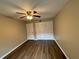 This bedroom features hardwood floors and closet space at 2992 Parc Lorraine, Lithonia, GA 30038