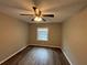This bedroom features a ceiling fan and a bright window at 2992 Parc Lorraine, Lithonia, GA 30038