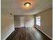 This bedroom offers hardwood flooring and a sunlit window at 2992 Parc Lorraine, Lithonia, GA 30038