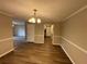 Cozy dining room featuring hardwood floors and a view of the kitchen at 2992 Parc Lorraine, Lithonia, GA 30038