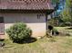 Exterior view of home number 5 featuring a manicured bush and tree at 2992 Parc Lorraine, Lithonia, GA 30038