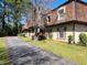 Charming townhomes featuring red roofs and private driveways, surrounded by lush trees at 2992 Parc Lorraine, Lithonia, GA 30038