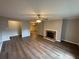 Open living room featuring a brick fireplace and hardwood flooring at 2992 Parc Lorraine, Lithonia, GA 30038