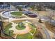 Overhead view of community park, including playgrounds, grassy areas, and walking paths near the community at 3207 Kensington Rd, Avondale Estates, GA 30002
