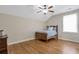 Comfortable bedroom features a ceiling fan and hardwood floors at 3207 Kensington Rd, Avondale Estates, GA 30002
