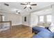 Spacious bonus room with hardwood floors, a blue couch, and a window bench at 3207 Kensington Rd, Avondale Estates, GA 30002