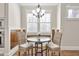 Cozy breakfast nook with a table, two chairs, a chandelier and natural light at 3207 Kensington Rd, Avondale Estates, GA 30002