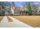 Beautiful craftsman style home featuring an inviting front porch, long driveway and detached garage at 3207 Kensington Rd, Avondale Estates, GA 30002