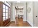 Inviting foyer leading to the dining room with decorative columns and hardwood floors at 3207 Kensington Rd, Avondale Estates, GA 30002