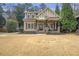 Charming craftsman-style home with a covered front porch and well-manicured landscaping at 3207 Kensington Rd, Avondale Estates, GA 30002