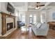 Comfortable living room with fireplace, hardwood floors and bright, airy feel at 3207 Kensington Rd, Avondale Estates, GA 30002