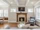 Welcoming living room with a fireplace, coffered ceilings, and abundant natural light at 3207 Kensington Rd, Avondale Estates, GA 30002