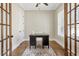 Cozy home office with a dark wood desk, shutters, and natural light at 3207 Kensington Rd, Avondale Estates, GA 30002