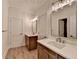 Bright bathroom featuring double sink vanity with white countertop and modern fixtures at 5533 Addison Woods Pl, Buford, GA 30518