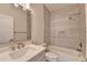 Contemporary bathroom featuring a shower-over-tub, sleek vanity, and modern fixtures at 5533 Addison Woods Pl, Buford, GA 30518