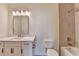 Bathroom featuring single sink vanity with granite countertop, tile floors and shower with tub at 5533 Addison Woods Pl, Buford, GA 30518