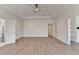 Spacious bedroom with wood flooring, recessed lights, and tray ceiling at 5533 Addison Woods Pl, Buford, GA 30518
