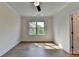 Bedroom featuring luxury vinyl plank flooring and a large window, allowing lots of natural light at 5533 Addison Woods Pl, Buford, GA 30518