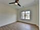 Bright bedroom showcasing laminate floors and a large window for natural light at 5533 Addison Woods Pl, Buford, GA 30518