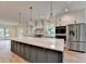 Kitchen with large island, stainless steel appliances, and custom cabinetry at 5533 Addison Woods Pl, Buford, GA 30518