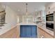 Kitchen with a large island, stainless steel appliances, and custom blue cabinetry at 5533 Addison Woods Pl, Buford, GA 30518
