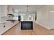 Modern kitchen featuring a large island, white cabinets, and stainless steel appliances at 5533 Addison Woods Pl, Buford, GA 30518