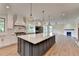 Spacious kitchen with large island, stainless steel appliances, and white cabinetry at 5533 Addison Woods Pl, Buford, GA 30518
