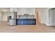 Cozy kitchenette with laminate flooring, stainless steel appliances, and ample cabinet storage at 5533 Addison Woods Pl, Buford, GA 30518