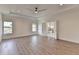 Large main bedroom with wood floors, ensuite bathroom and natural light at 5533 Addison Woods Pl, Buford, GA 30518